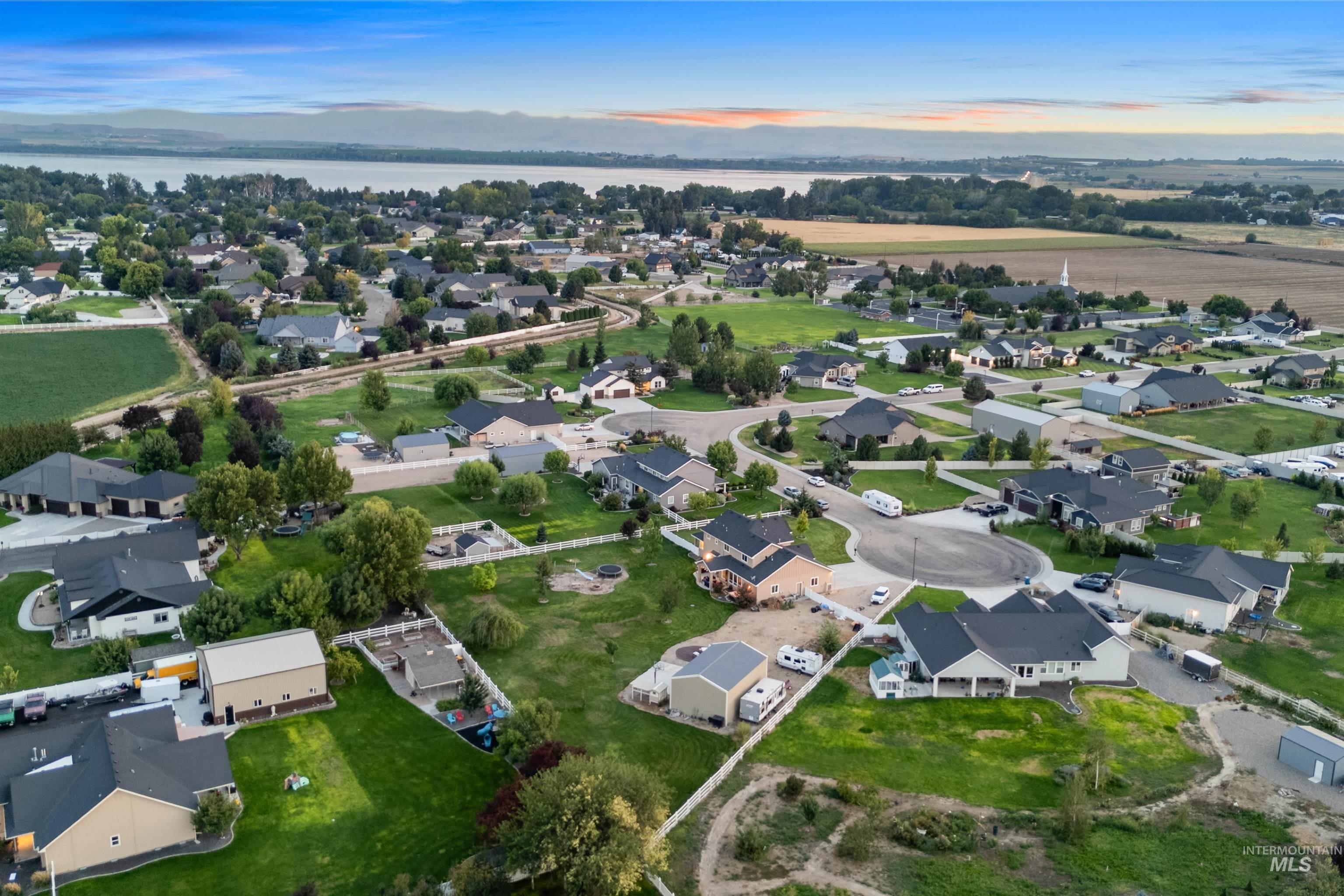 Aerial overview of property's location featuring nearby suburban area and a large body of water