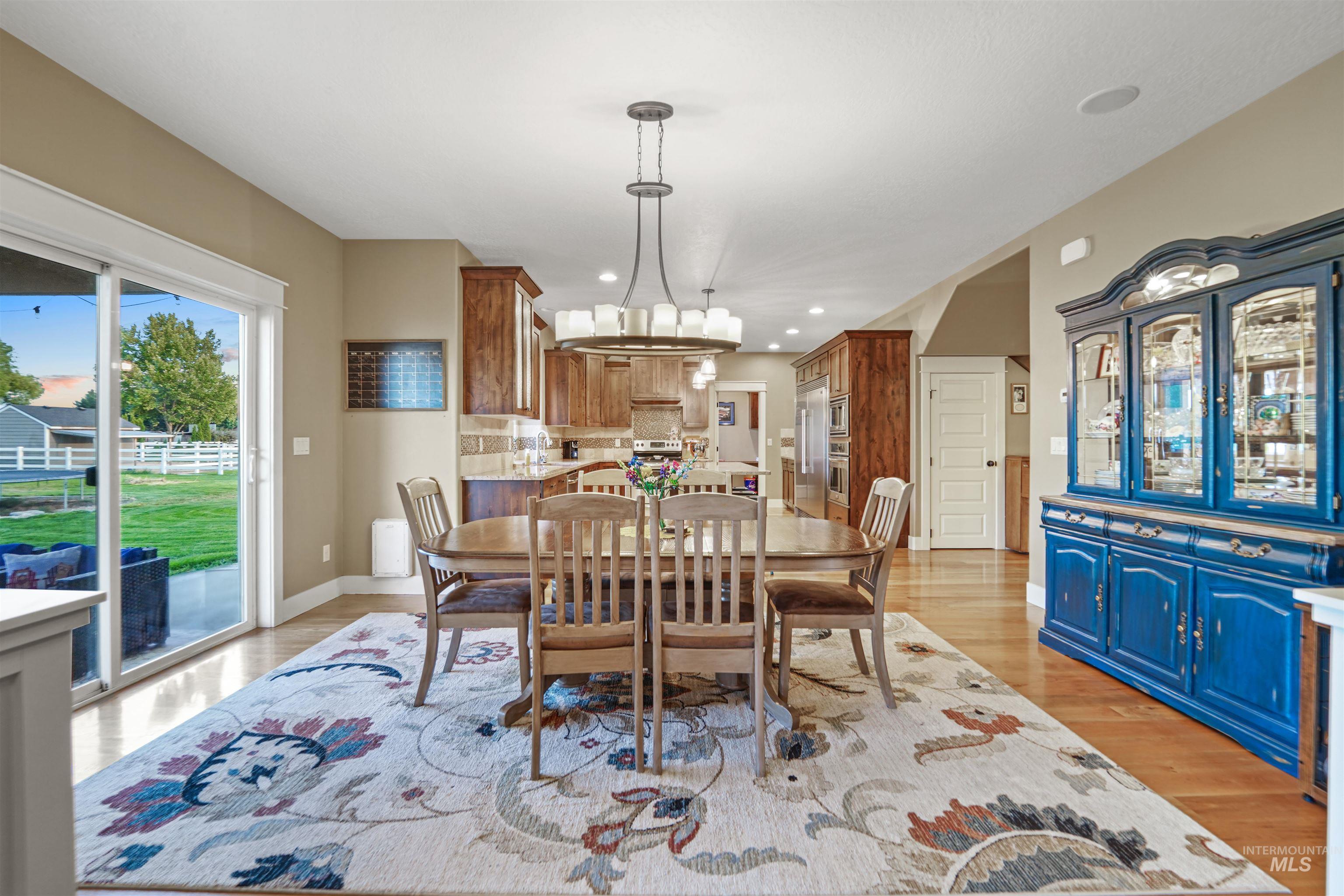Dining room featuring light wood finished floors and recessed lighting