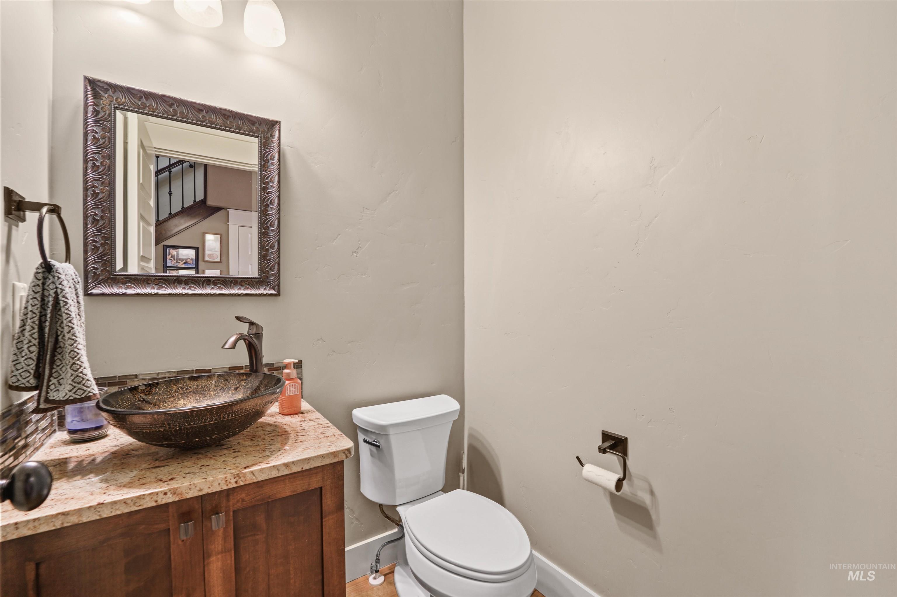 Half bath with vanity and toilet