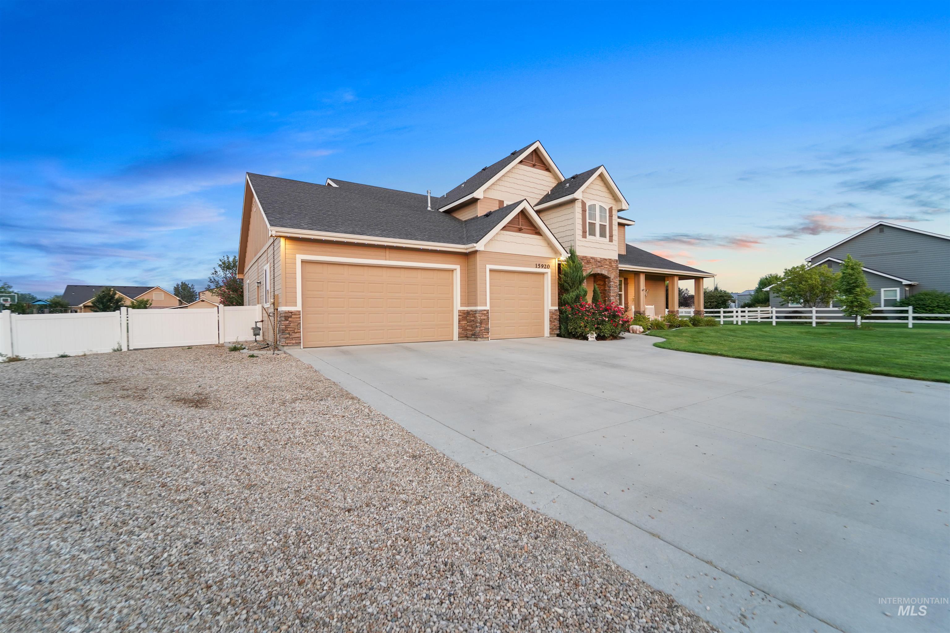 Craftsman-style house with driveway, a porch, stone siding, a garage, and a shingled roof