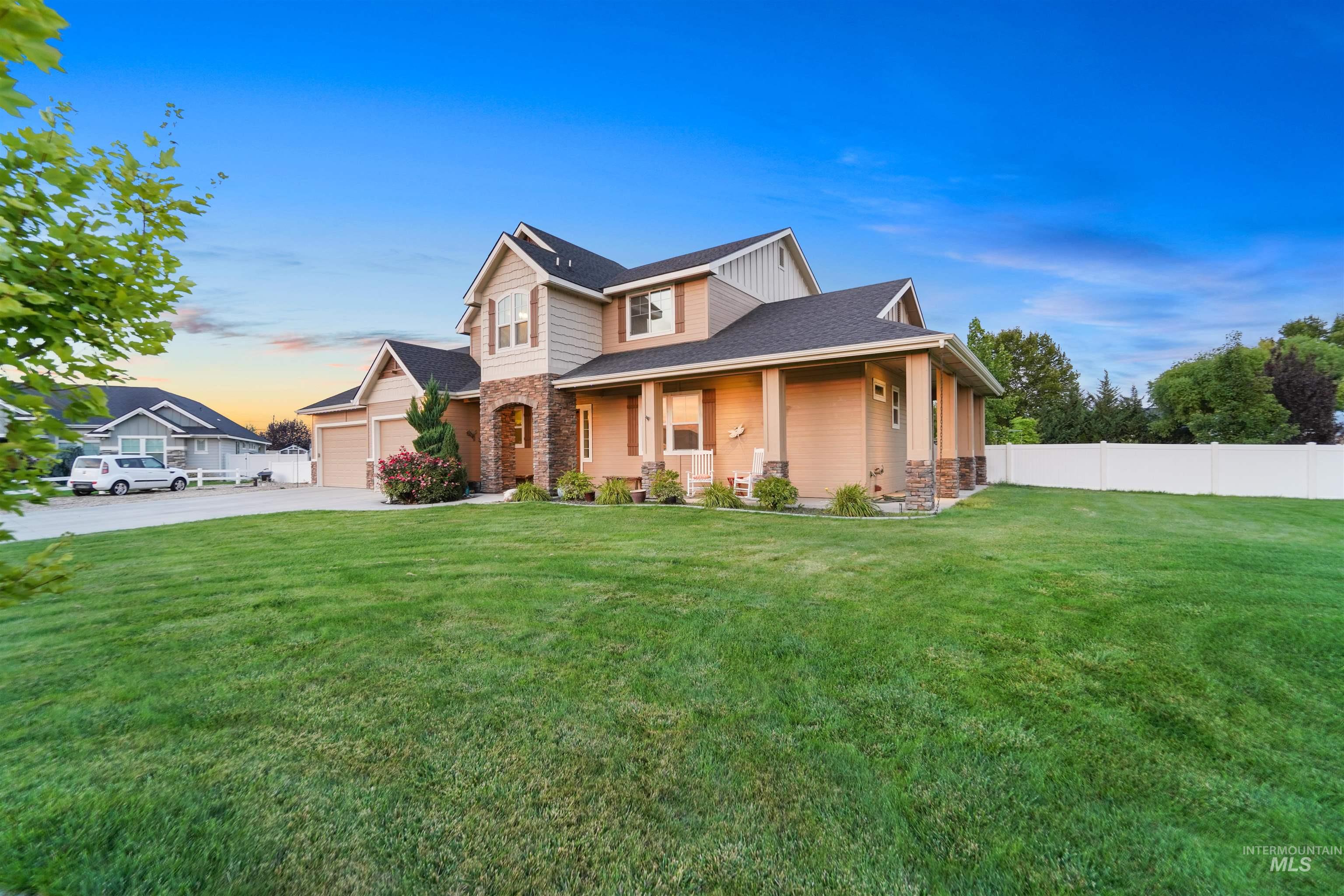View of front of home featuring a porch, stone siding, concrete driveway, and roof with shingles