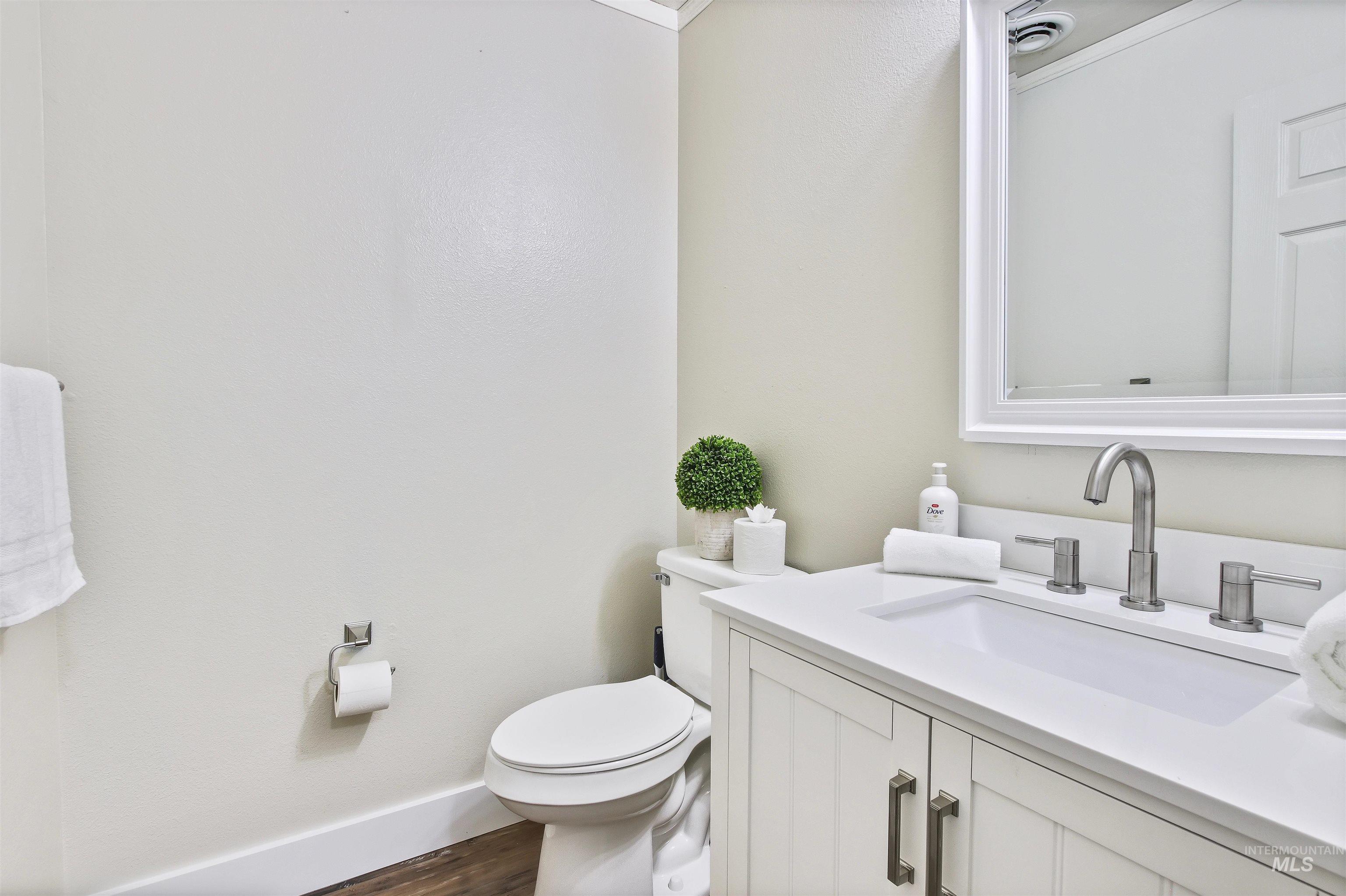 Bathroom with vanity and dark wood finished floors