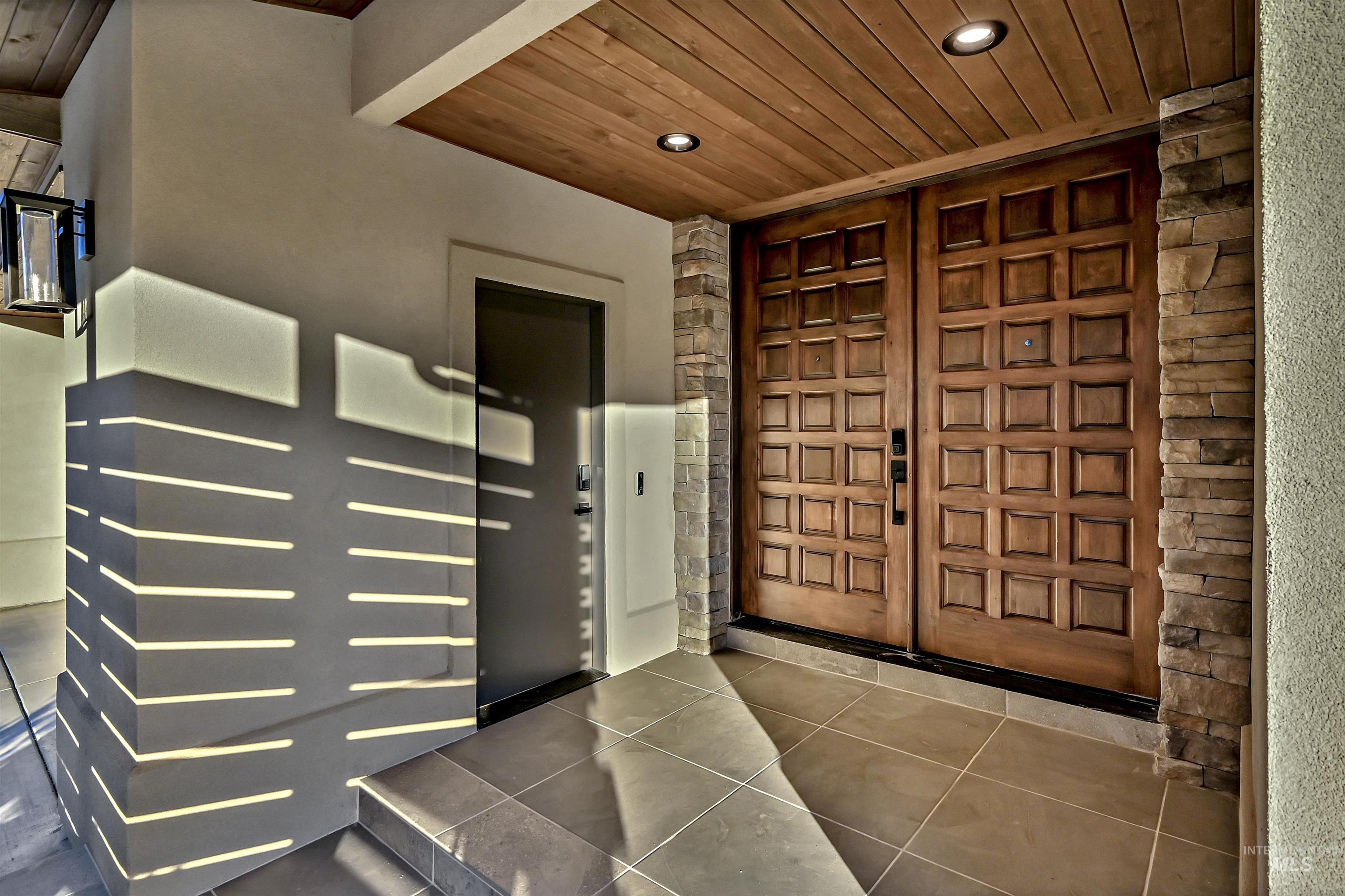 Double entry doors featuring a square panel design with dark hardware
