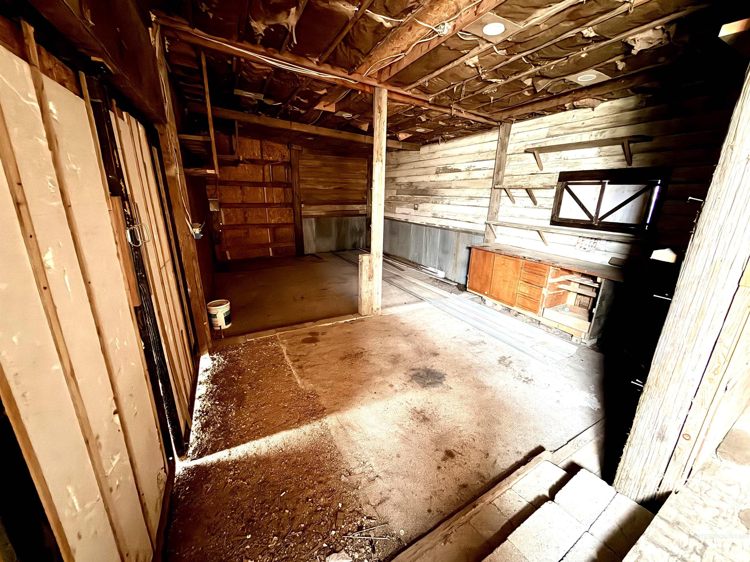 Miscellaneous room with wood walls