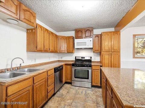 Photo of 621 E 73rd Avenue, Anchorage, AK 99518 (MLS # 26-12862)