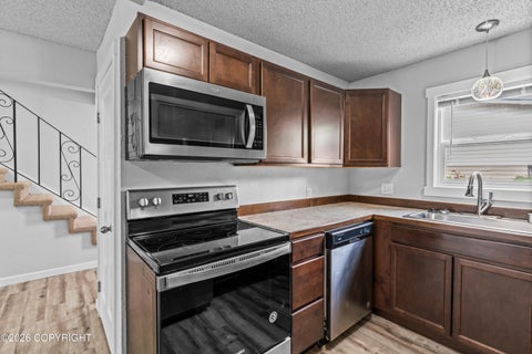 Photo of 450 Dailey Avenue #A6, Anchorage, AK 99515 (MLS # 26-12800)