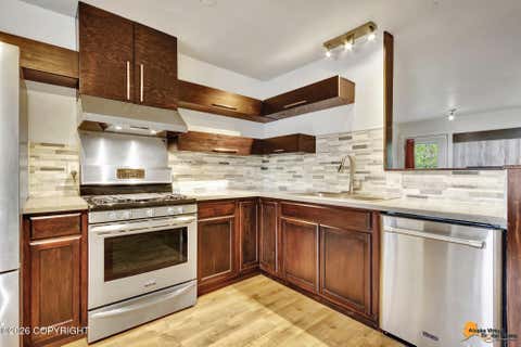 Photo of 8601 Molanary Drive #3, Anchorage, AK 99502 (MLS # 26-6716)