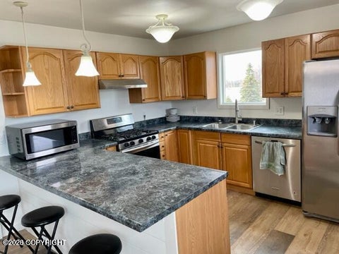 Photo of 9108 Jewel Terrace Street #B, Anchorage, AK 99502 (MLS # 26-12163)