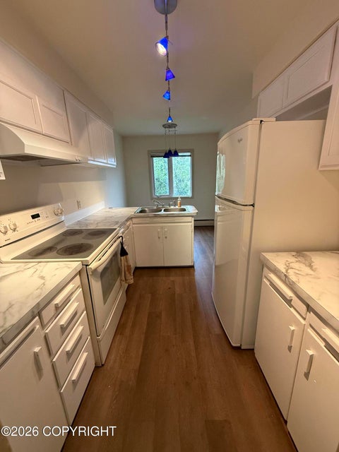 Photo of 1900 W 32nd Avenue #A, Anchorage, AK 99517 (MLS # 26-10856)
