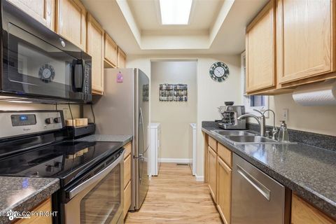 Photo of 7312 Huntsmen Circle #D-17, Anchorage, AK 99518 (MLS # 26-4972)