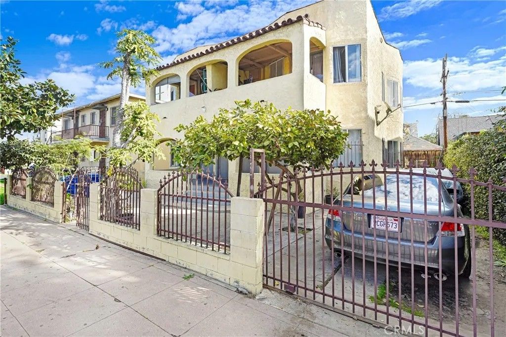 Photo of 1608 Cimarron Street, Los Angeles, CA 90019 (MLS # DW26018325)