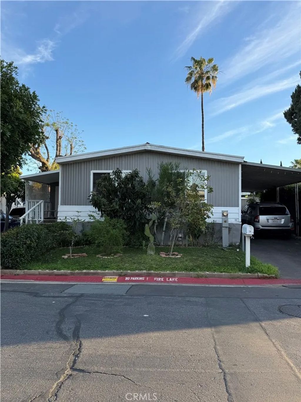 Photo of 995 Pomona Rd,#24 Rd, Corona, CA 92882 (MLS # CV26047069)