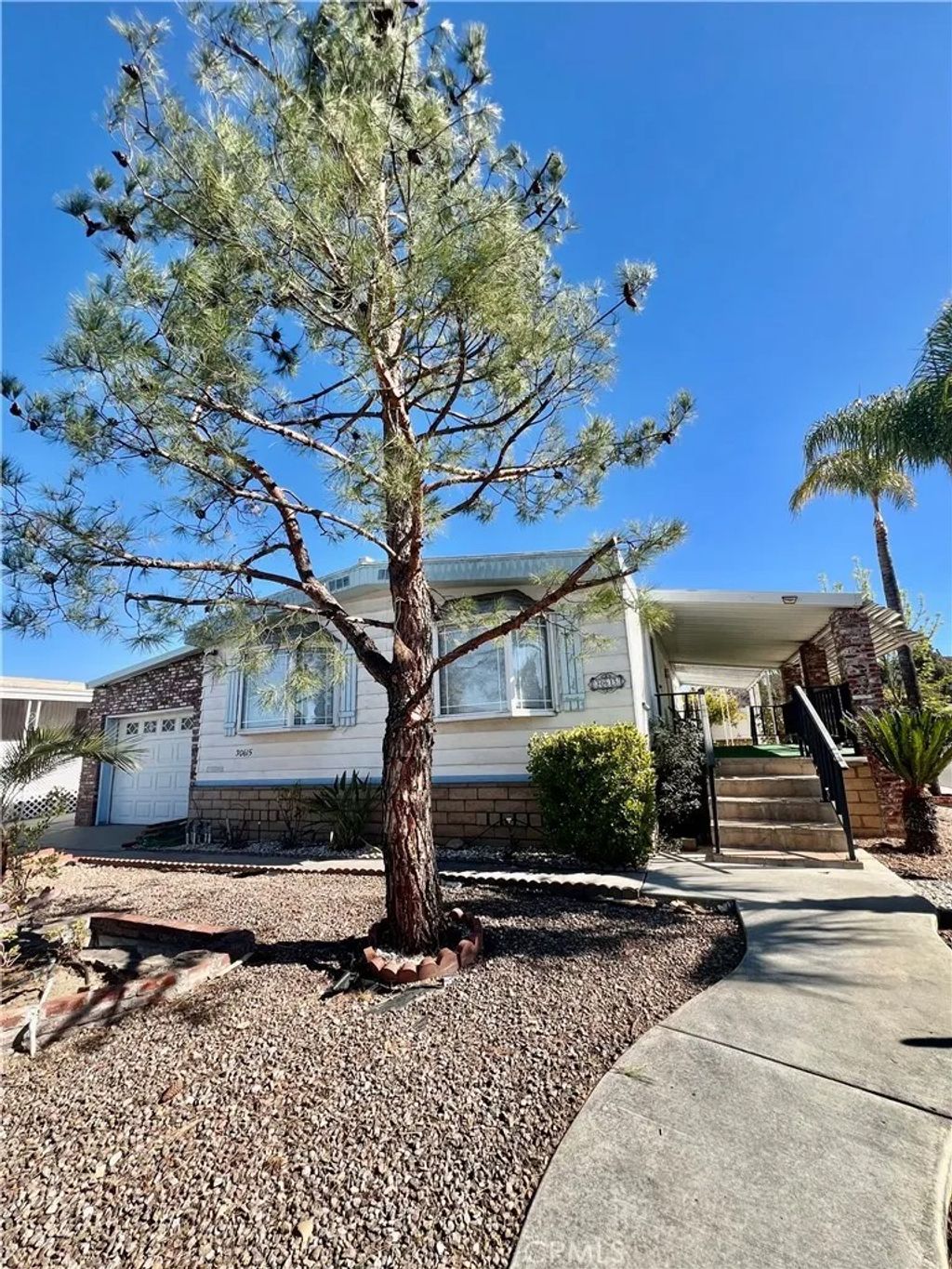 Photo of 30615 Arenga Palm Dr, Homeland, CA 92548 (MLS # SW26054106)