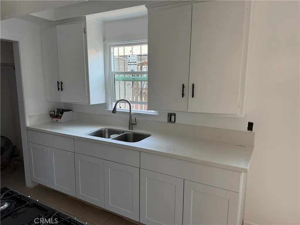 Photo of 1310 W 89th Street, Los Angeles, CA 90044 (MLS # PW26008937)