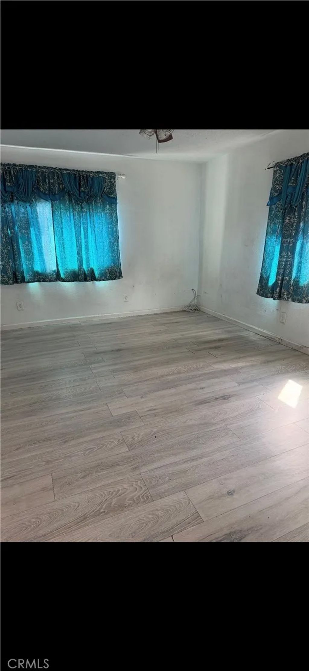 Photo of 210 W Lugonia Ave, Redlands, CA 92374 (MLS # CV26072421)