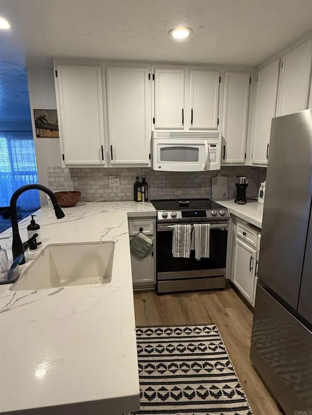 Photo of 7704 Caminito Tingo #102, Carlsbad, CA 92009 (MLS # NDP2511522)