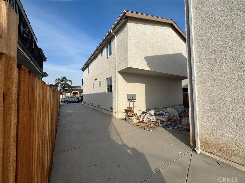 Photo of 1046 W 84th Place, Los Angeles, CA 90044 (MLS # PW25279944)