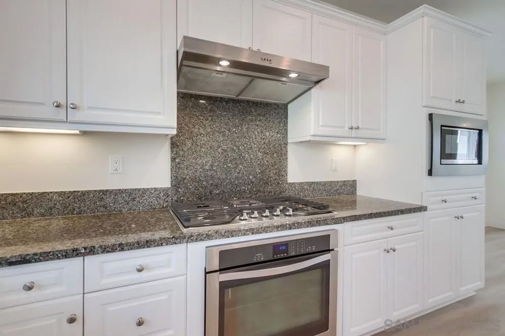 Photo of 6012 Village Center Loop Rd #38, San Diego, CA 92130 (MLS # 260003019)