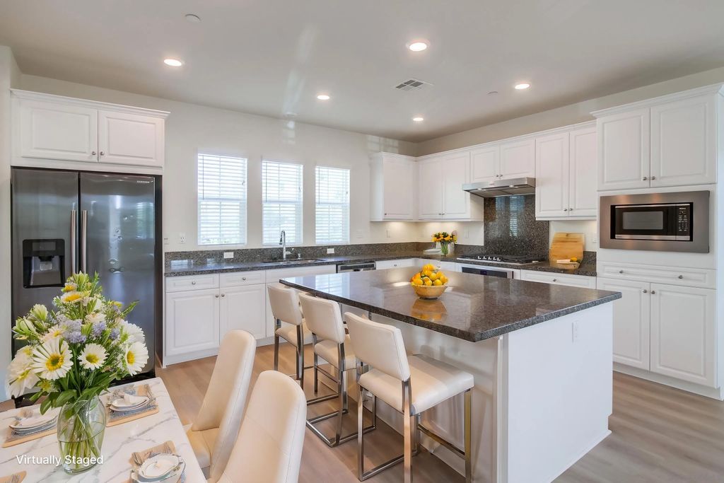 Photo of 6012 Village Center Loop Rd #38, San Diego, CA 92130 (MLS # 260003019)