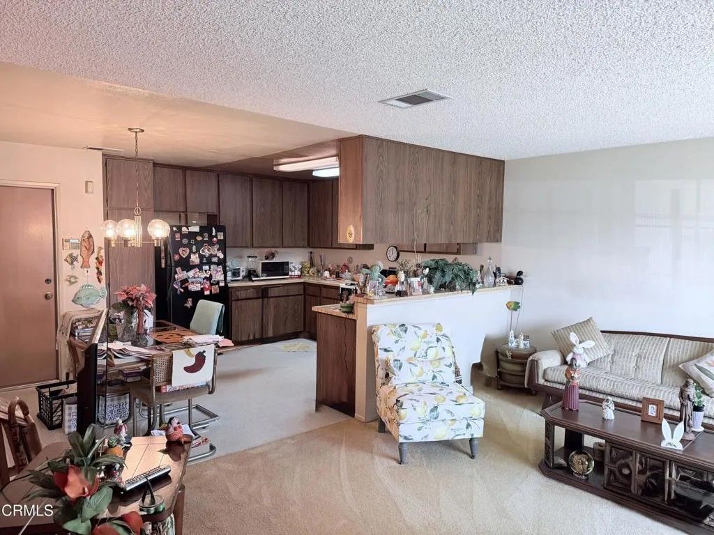 Photo of 13900 Studebaker Rd #24, Norwalk, CA 90650 (MLS # P1-26665)
