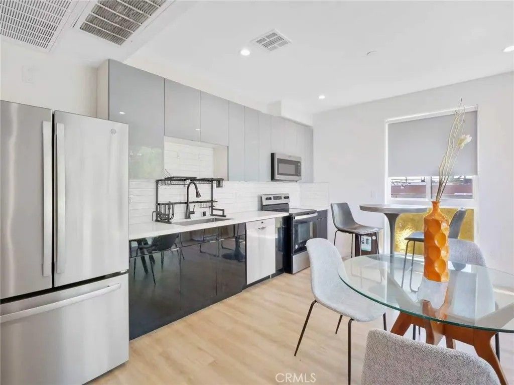 Photo of 3105 W Normandie Avenue, Los Angeles, CA 90018 (MLS # SB26113481)