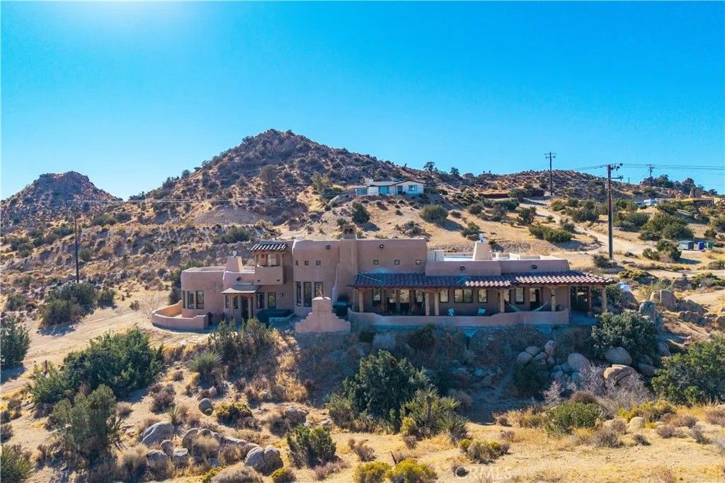 Photo of 5597 Acoma Trail, Yucca Valley, CA 92284 (MLS # JT26002821)