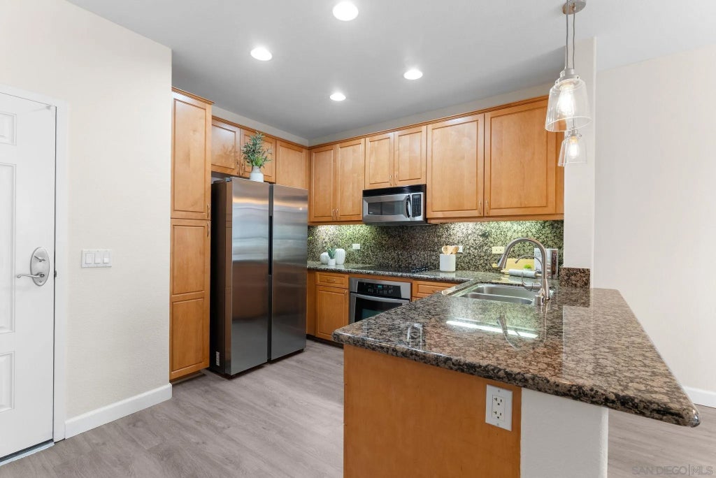 Photo of 3877 Pell Place #307, San Diego, CA 92130 (MLS # 260012549)