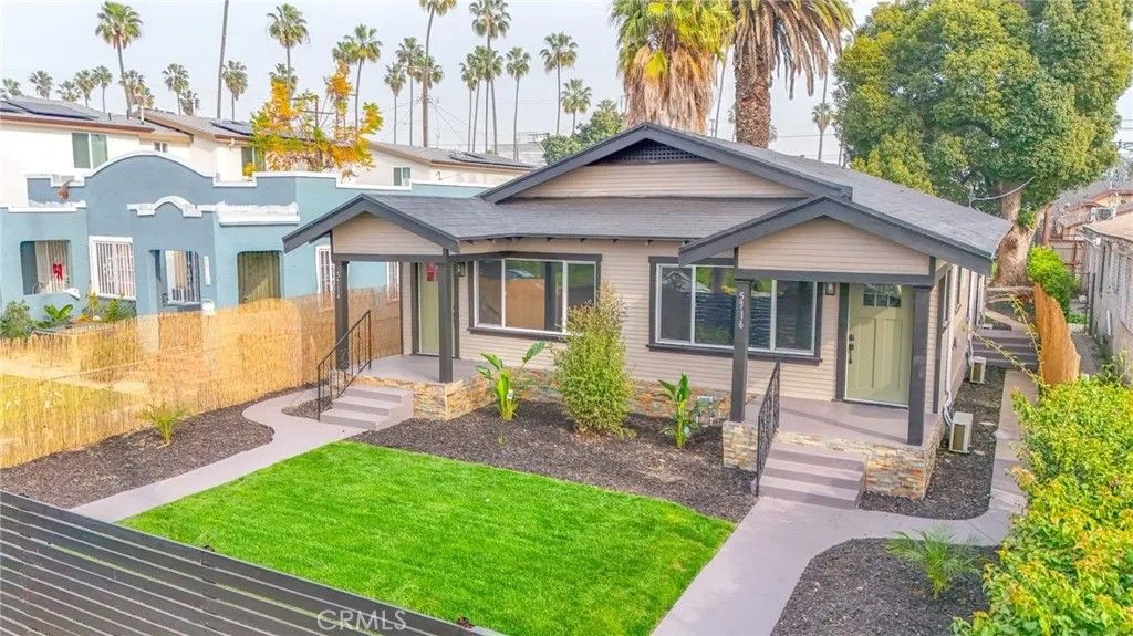 Photo of 5714 S St Andrews Pl, Los Angeles, CA 90062 (MLS # DW26016071)