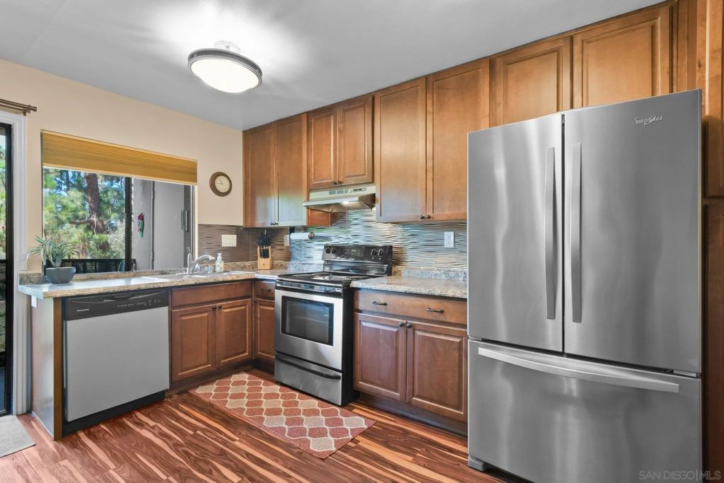 Photo of 7835 Cowles Mountain Ct #B6, San Diego, CA 92119 (MLS # 260002042)