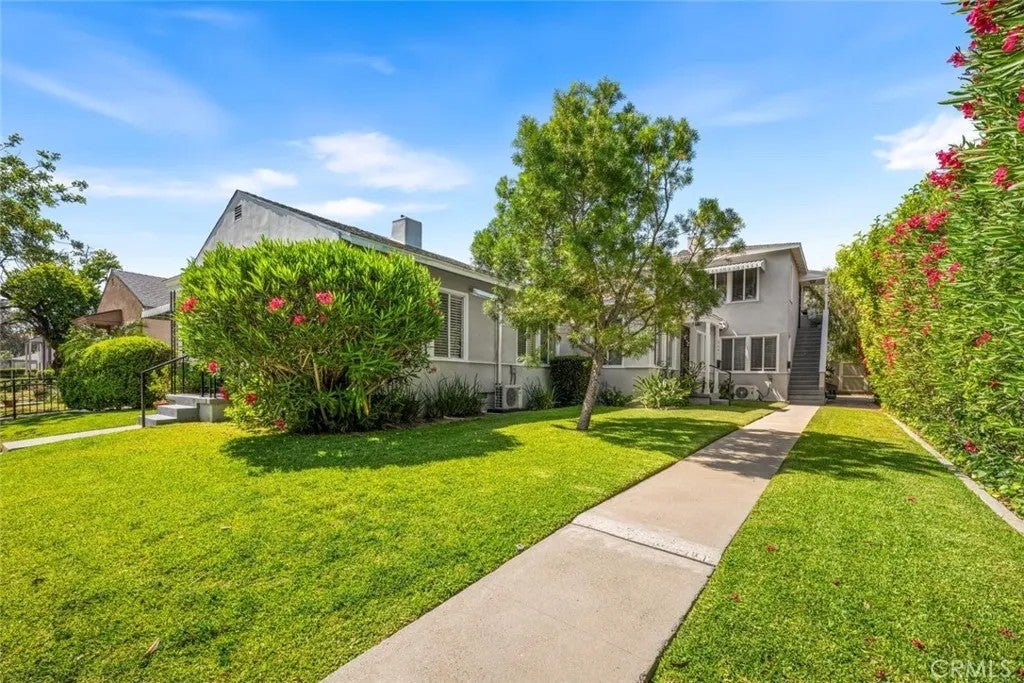 Photo of 5139 E Carson Street, Long Beach, CA 90808 (MLS # OC26131199)