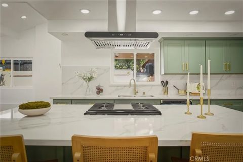 Photo of 6150 Strickland Avenue, Los Angeles, CA 90042 (MLS # DW26025568)