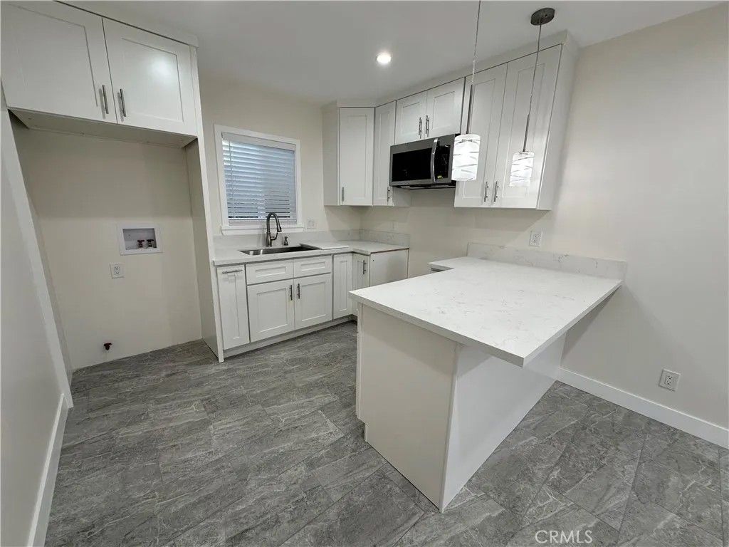 Photo of 12054 Lowemont St, Norwalk, CA 90650 (MLS # DW26072397)