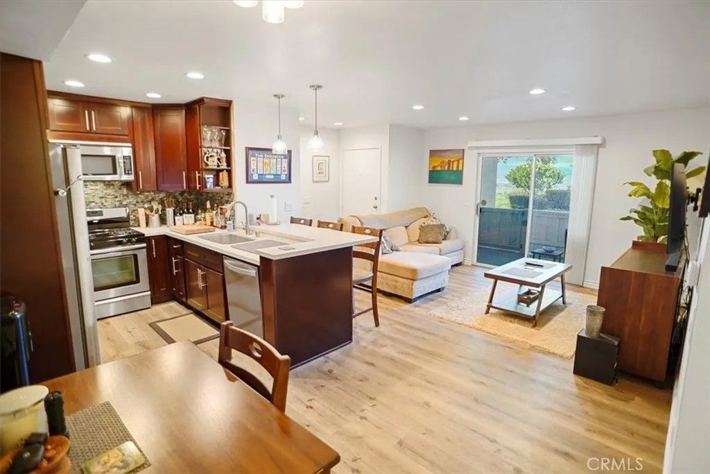 Photo of 24439 Leonard Tree Ln #102, Newhall, CA 91321 (MLS # SR25281785)