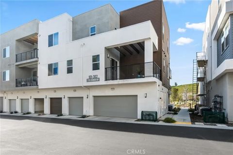Photo of 27209 Cranmore Way #203, Valencia, CA 91381 (MLS # CV26020348)