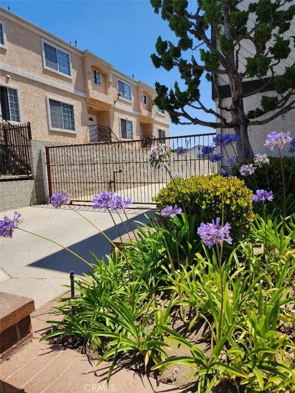 Photo of 15116 S RAYMOND Avenue #104, Gardena, CA 90247 (MLS # SB25279475)