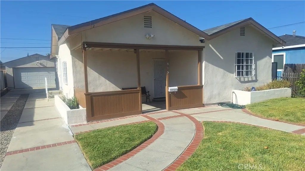 Photo of 815 W 134th Place, Compton, CA 90222 (MLS # IN26077993)