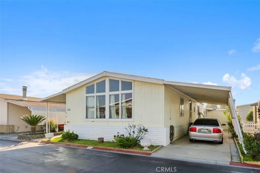 Photo of 1456 E Philadelphia St Spc 89 St, Ontario, CA 91761 (MLS # IV25280106)