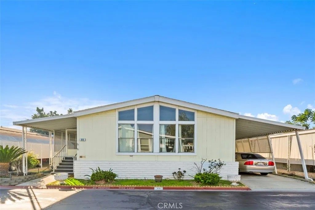 Photo of 1456 E Philadelphia St Spc 89 St, Ontario, CA 91761 (MLS # IV25280106)