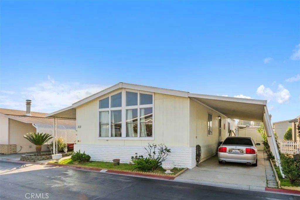 Photo of 1456 E Philadelphia St Spc 89 St, Ontario, CA 91761 (MLS # IV25280106)