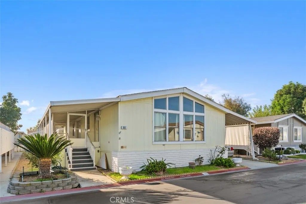 Photo of 1456 E Philadelphia St Spc 89 St, Ontario, CA 91761 (MLS # IV25280106)