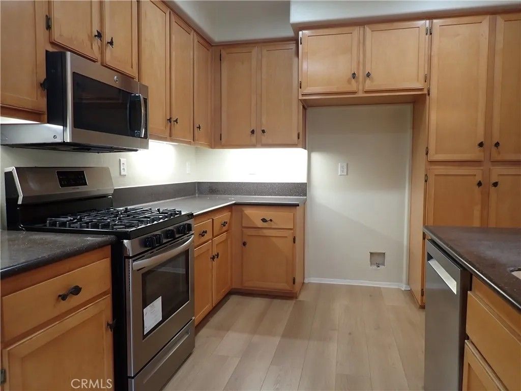 Photo of 55 Essex Ln, Irvine, CA 92620 (MLS # OC25277884)