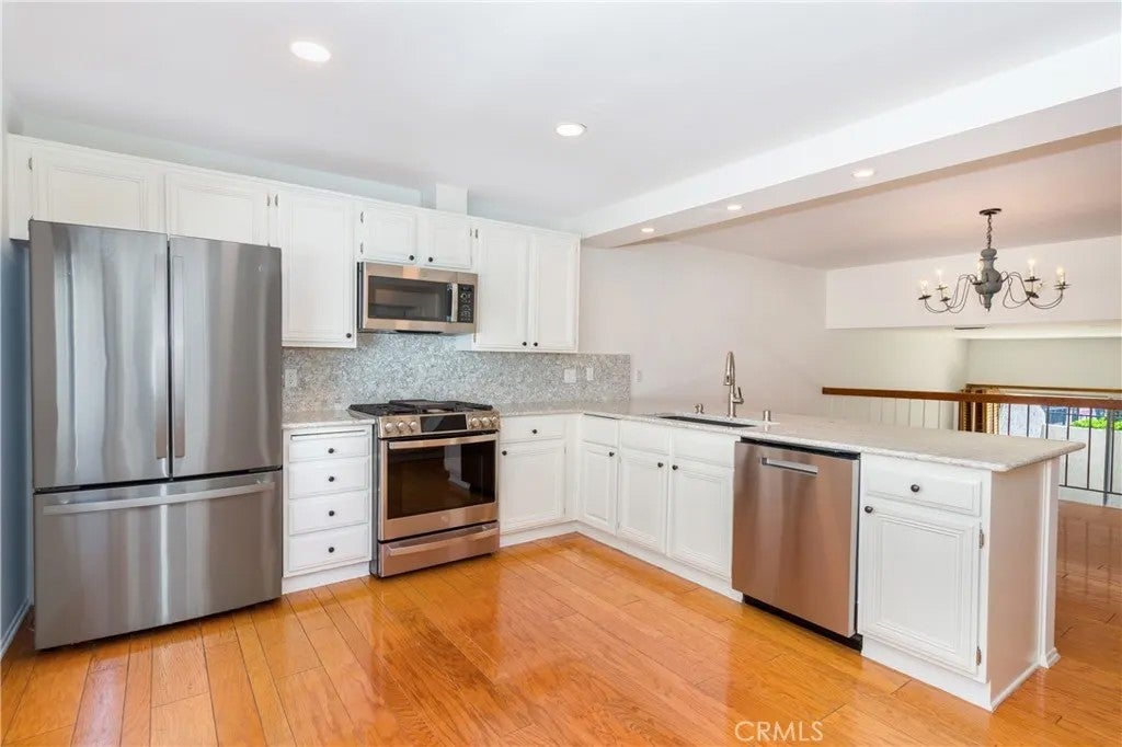 Photo of 18344 Collins Street #A, Tarzana, CA 91356 (MLS # SR26086794)