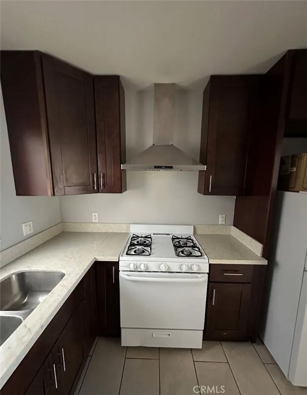 Photo of 1319 W 92nd St, Los Angeles, CA 90044 (MLS # SB26040347)