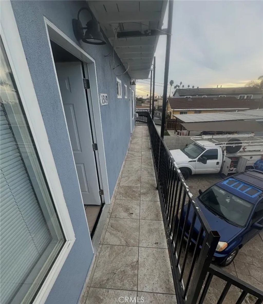 Photo of 1319 W 92nd St, Los Angeles, CA 90044 (MLS # SB26040347)