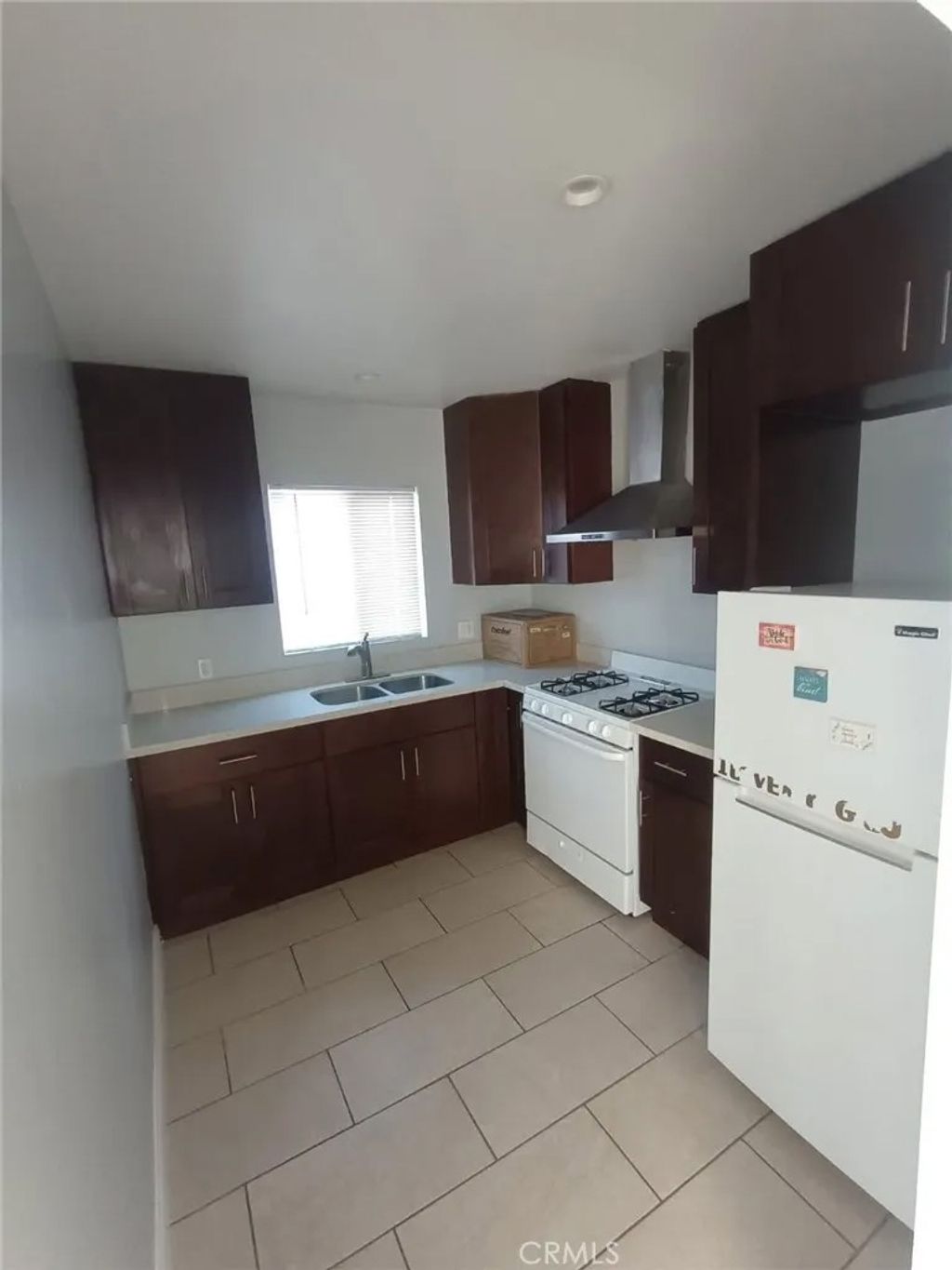 Photo of 1319 W 92nd St, Los Angeles, CA 90044 (MLS # SB26040347)