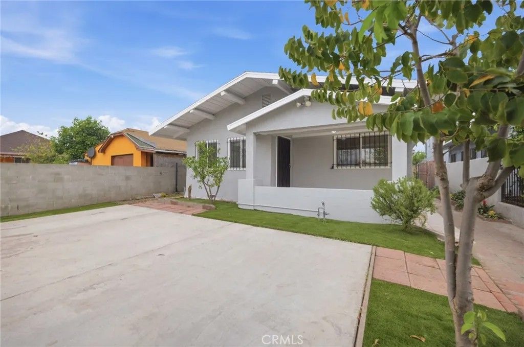Photo of 1345 W 51st Place, Los Angeles, CA 90037 (MLS # SB26065658)