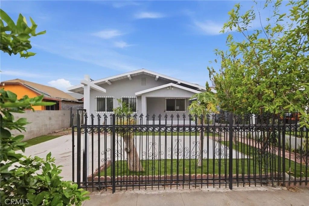 Photo of 1345 W 51st Place, Los Angeles, CA 90037 (MLS # SB26065658)