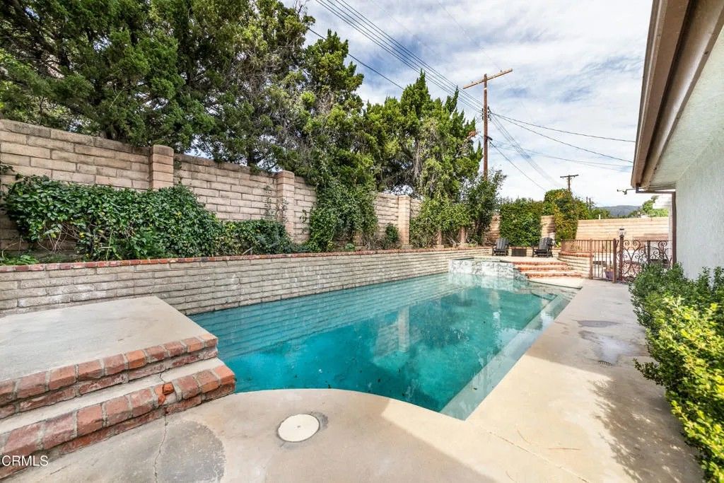 Photo of 10037 Sunnybrae Avenue, Los Angeles, CA 91311 (MLS # P1-25919)
