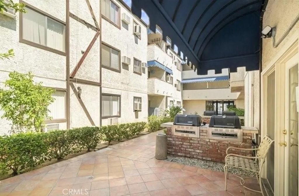 Photo of 18530 Hatteras Street #218, Tarzana, CA 91356 (MLS # BB26047246)