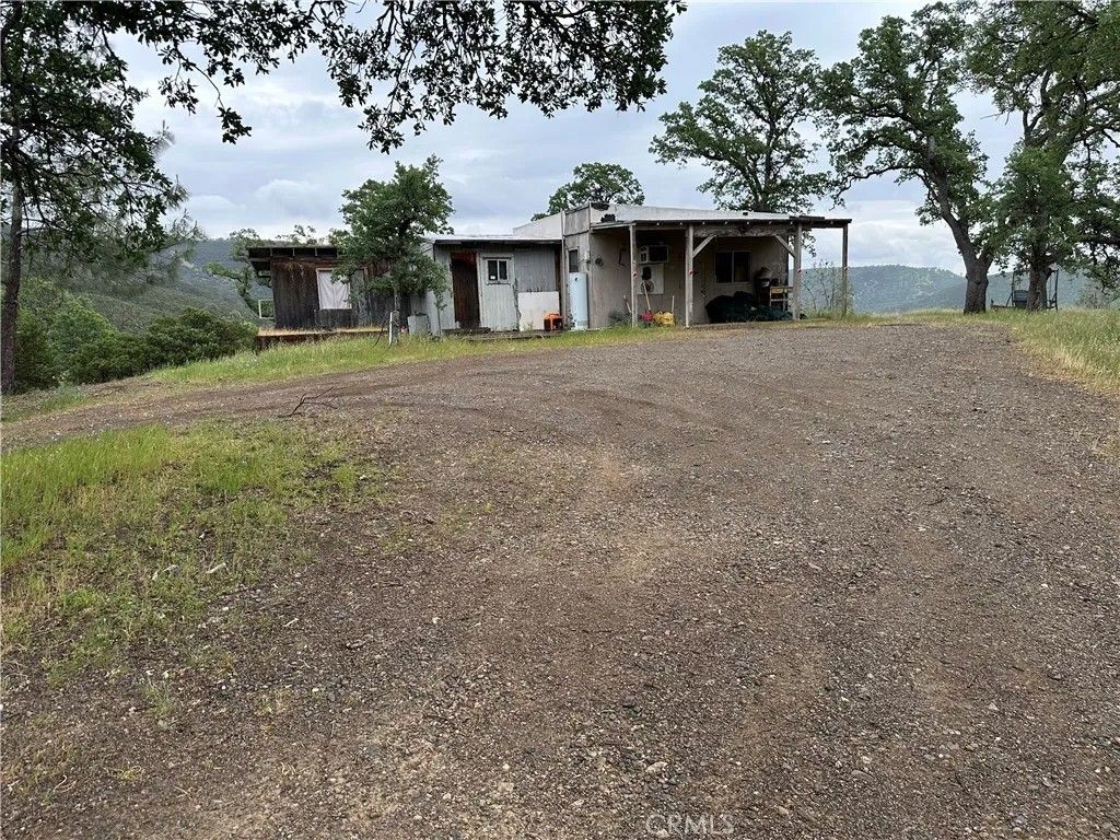 Photo of 666 Watertrough Road, Clearlake Oaks, CA 95423 (MLS # LC26069115)